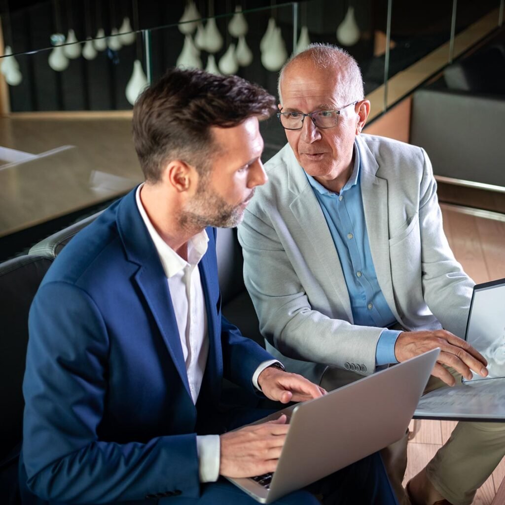 Business People Having Meeting In Modern Office In JHHWL8D 1024x1024